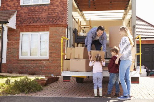 Packed household items ready for transport by a removal team