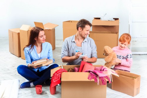 Business relocation team transporting office furniture in Wandsworth