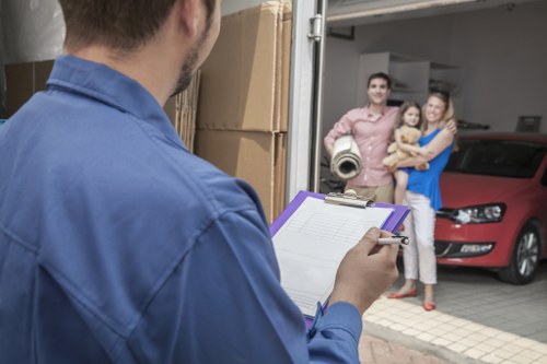 Movers handling furniture in a Wandsworth flat