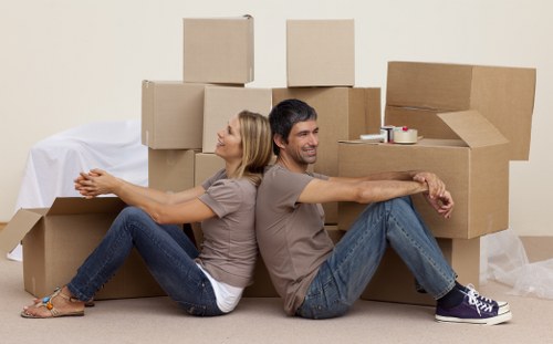 Packed boxes and furniture ready for a removals van service