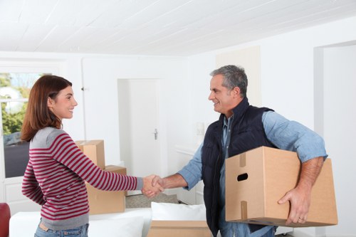 Professional movers handling items during a flat move in Wandsworth