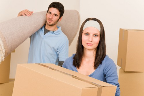 Professional movers loading furniture into a van